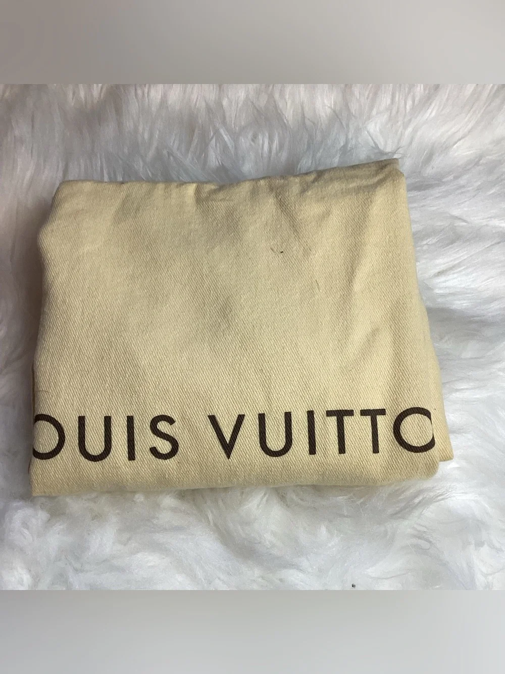 Louis Vuitton Damier Ebene District MM messenger bag.